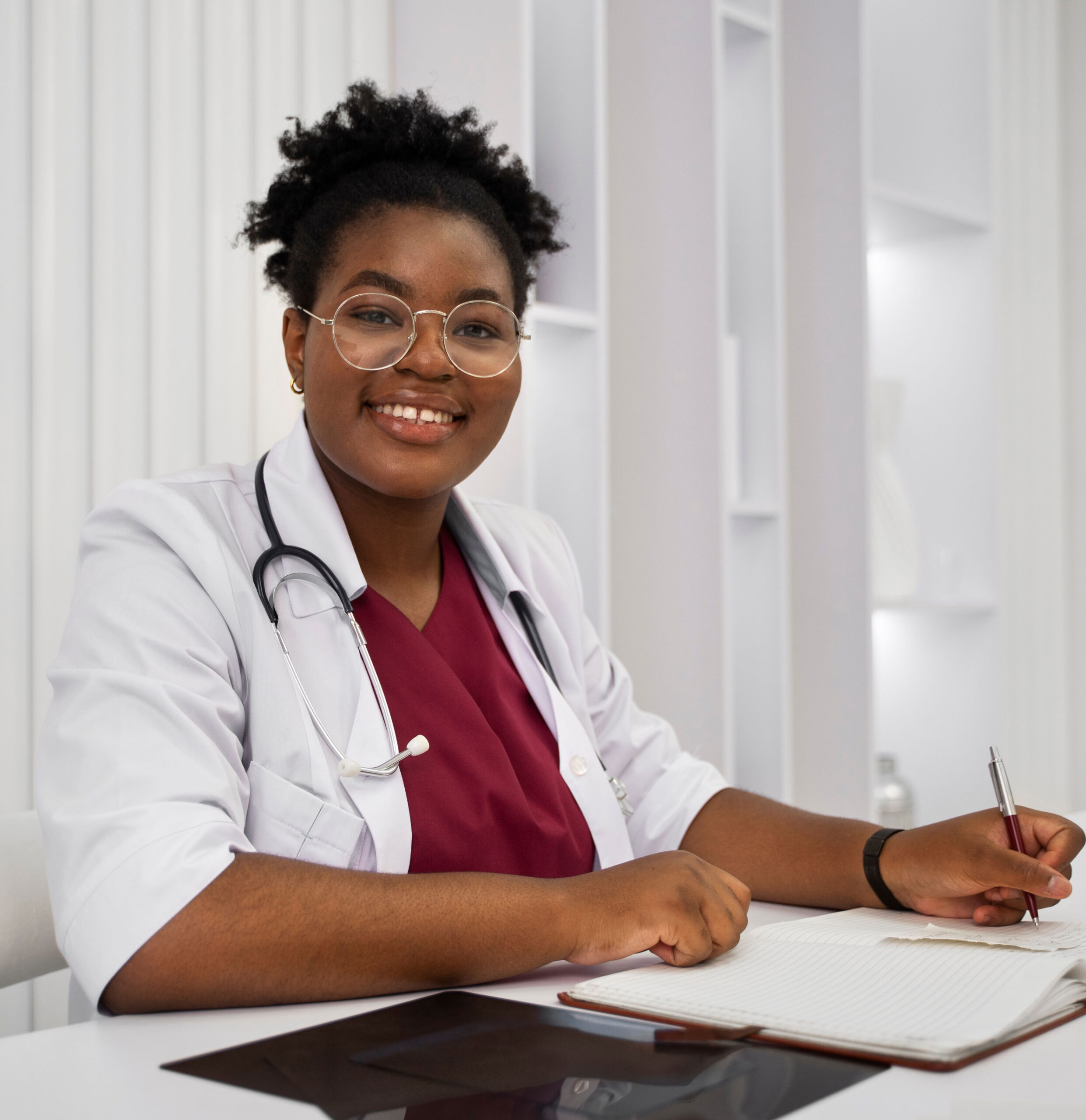 Researcher writing notes in a clinical setting